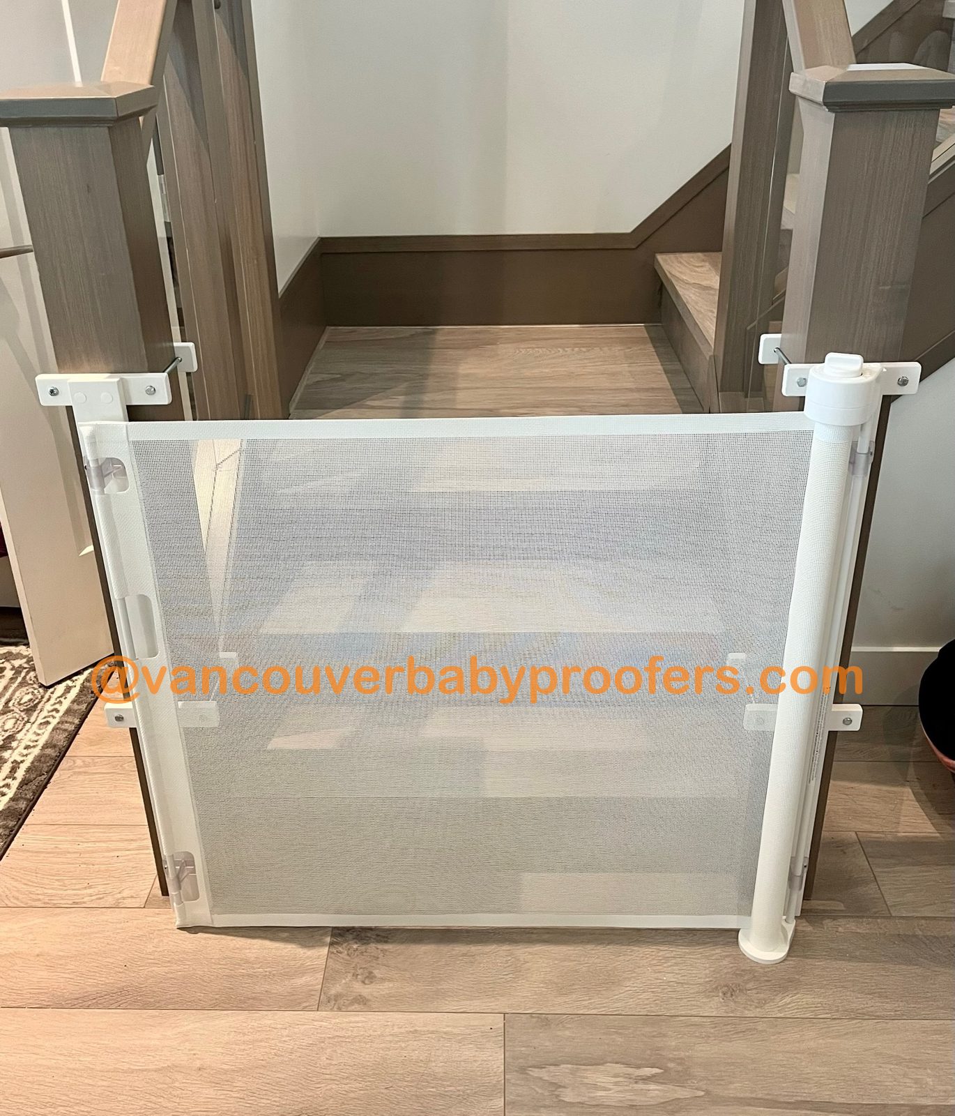 Wood banisters, no-hole clamps installation by Vancouver Baby Proofers