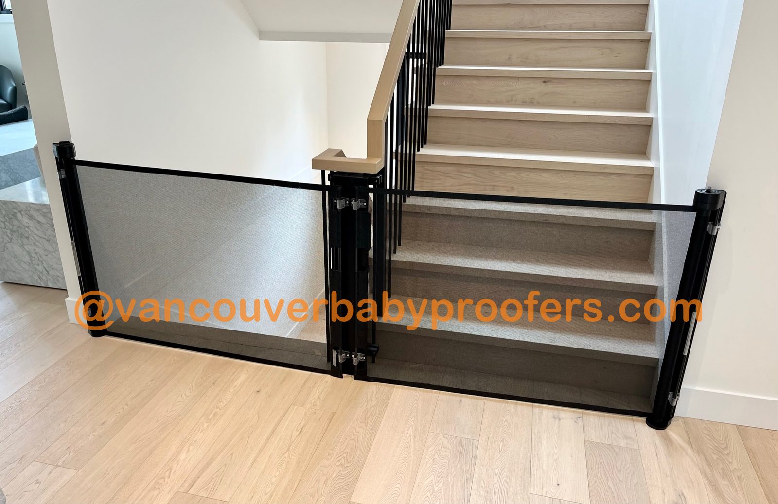 Wood banisters, no-hole clamps installation by Vancouver Baby Proofers