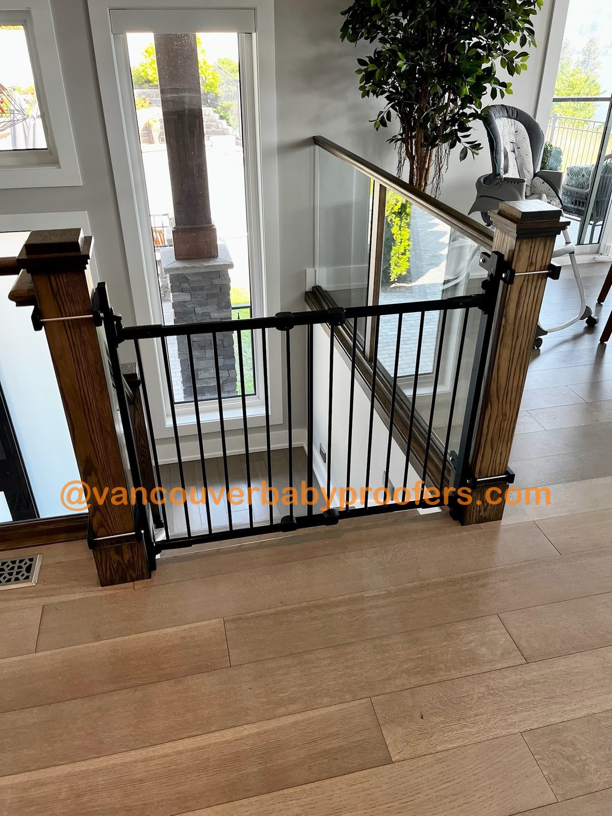 Wood banisters, no-hole clamps installation by Vancouver Baby Proofers