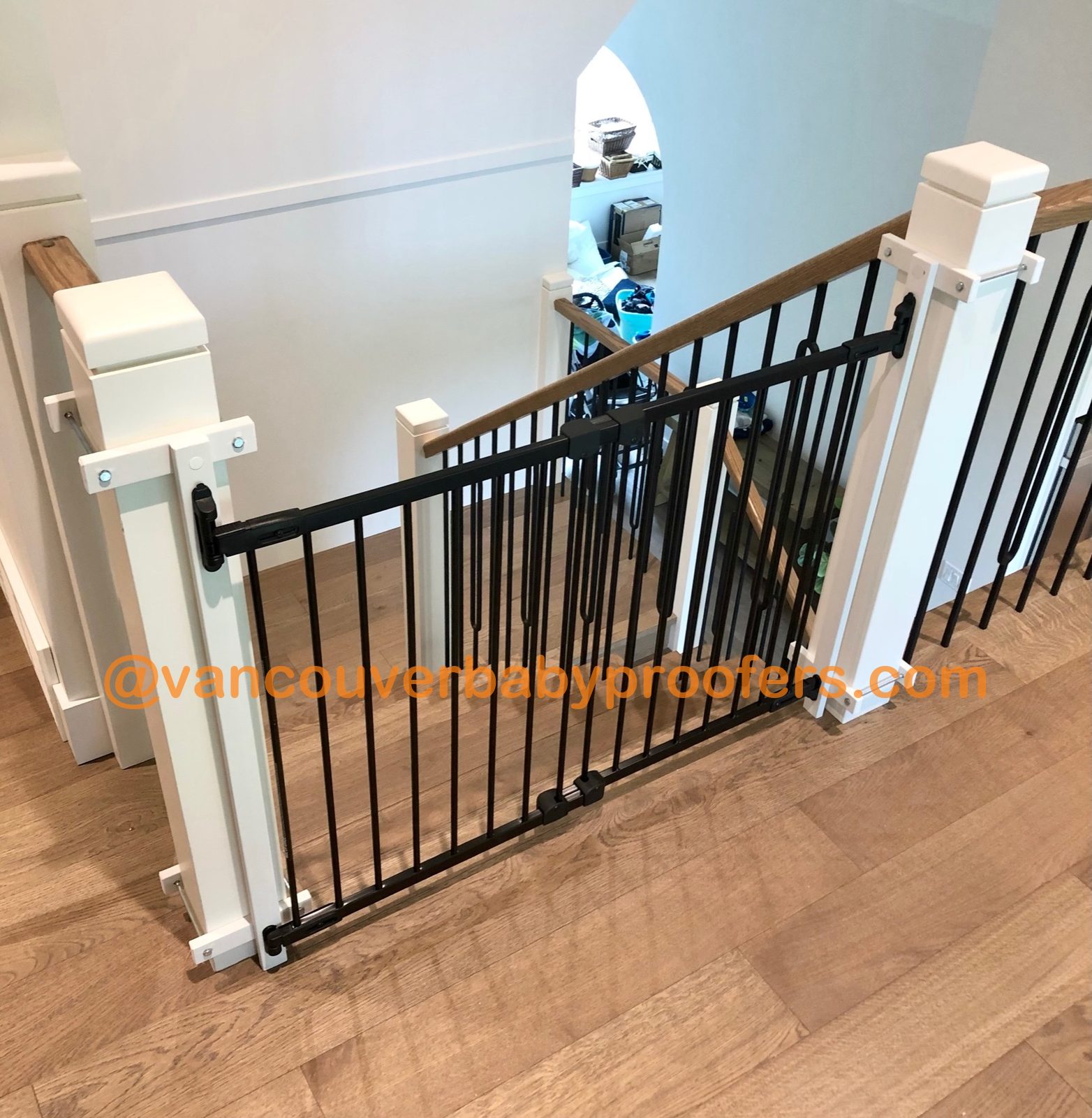 Wood banisters, no-hole clamps installation by Vancouver Baby Proofers