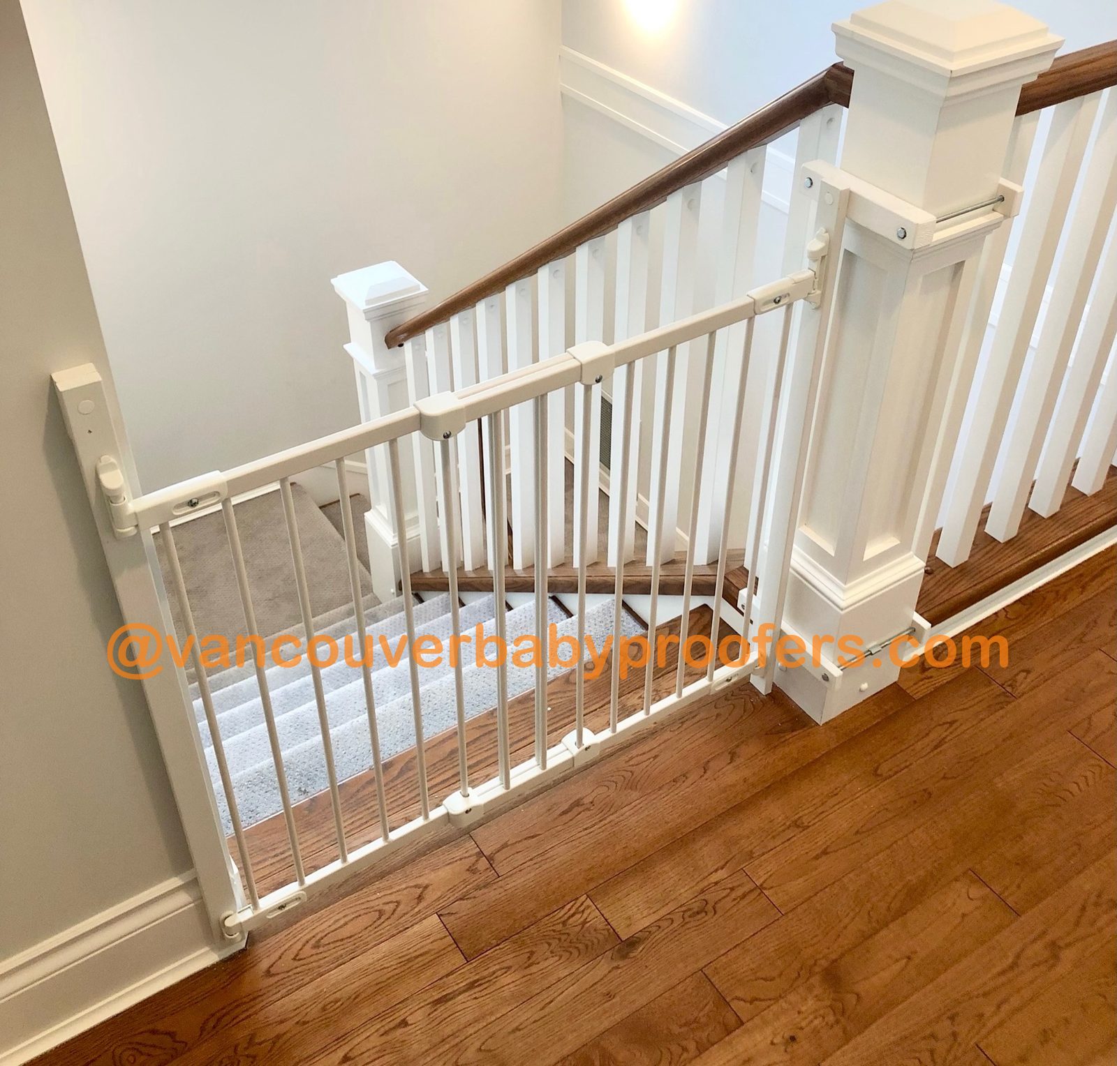 Wood banisters, no-hole clamps installation by Vancouver Baby Proofers