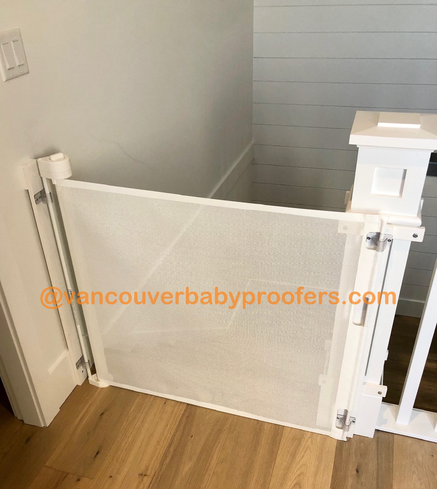 Wood banisters, no-hole clamps installation by Vancouver Baby Proofers