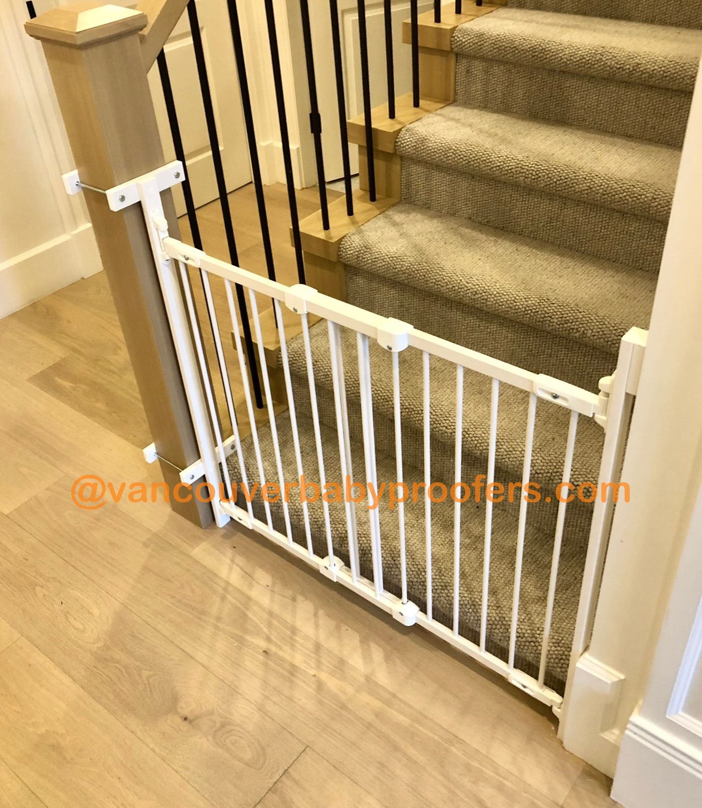 Wood banisters, no-hole clamps installation by Vancouver Baby Proofers
